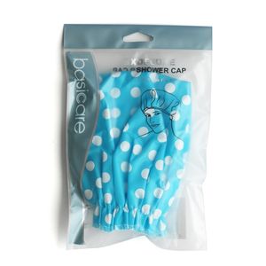 Cofia de baño azul con lunares blancos