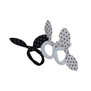 Gomita elastica con moño blanco y negro (4 unidades)